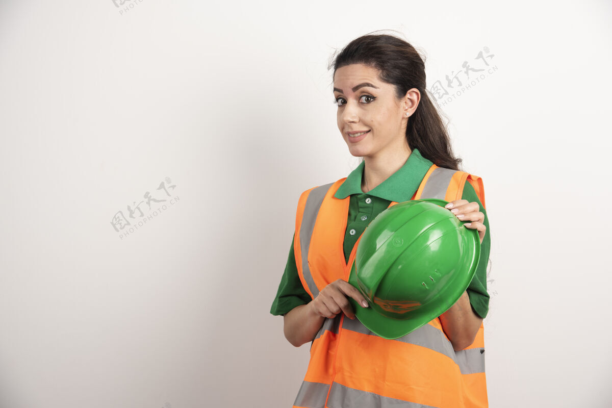 建筑成功的女人戴着安全帽穿着制服高质量的照片建筑商工作头盔